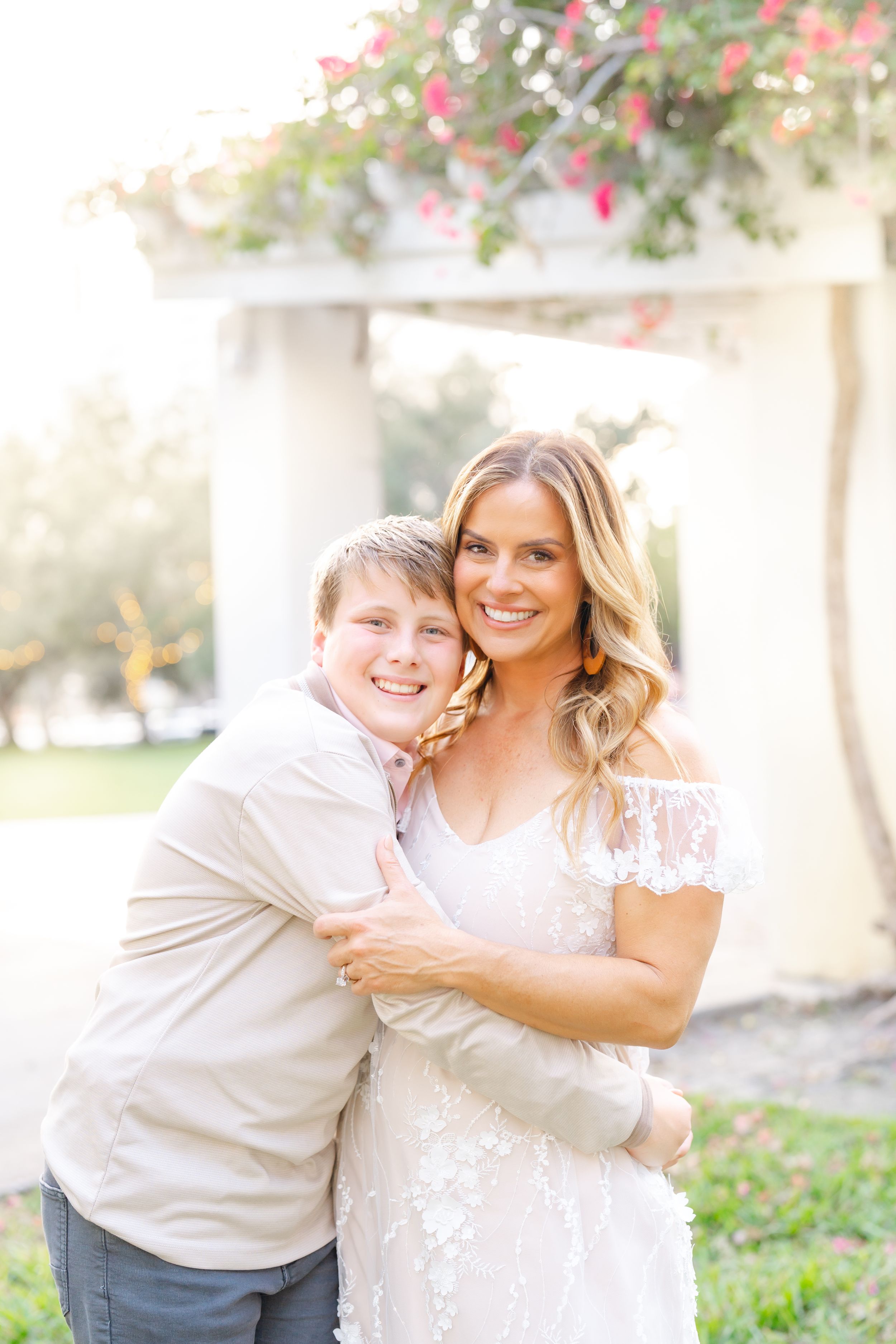 mother and son cuddling together with big smiles at The Vinoy in St. Pete FL during their family photoshoot.