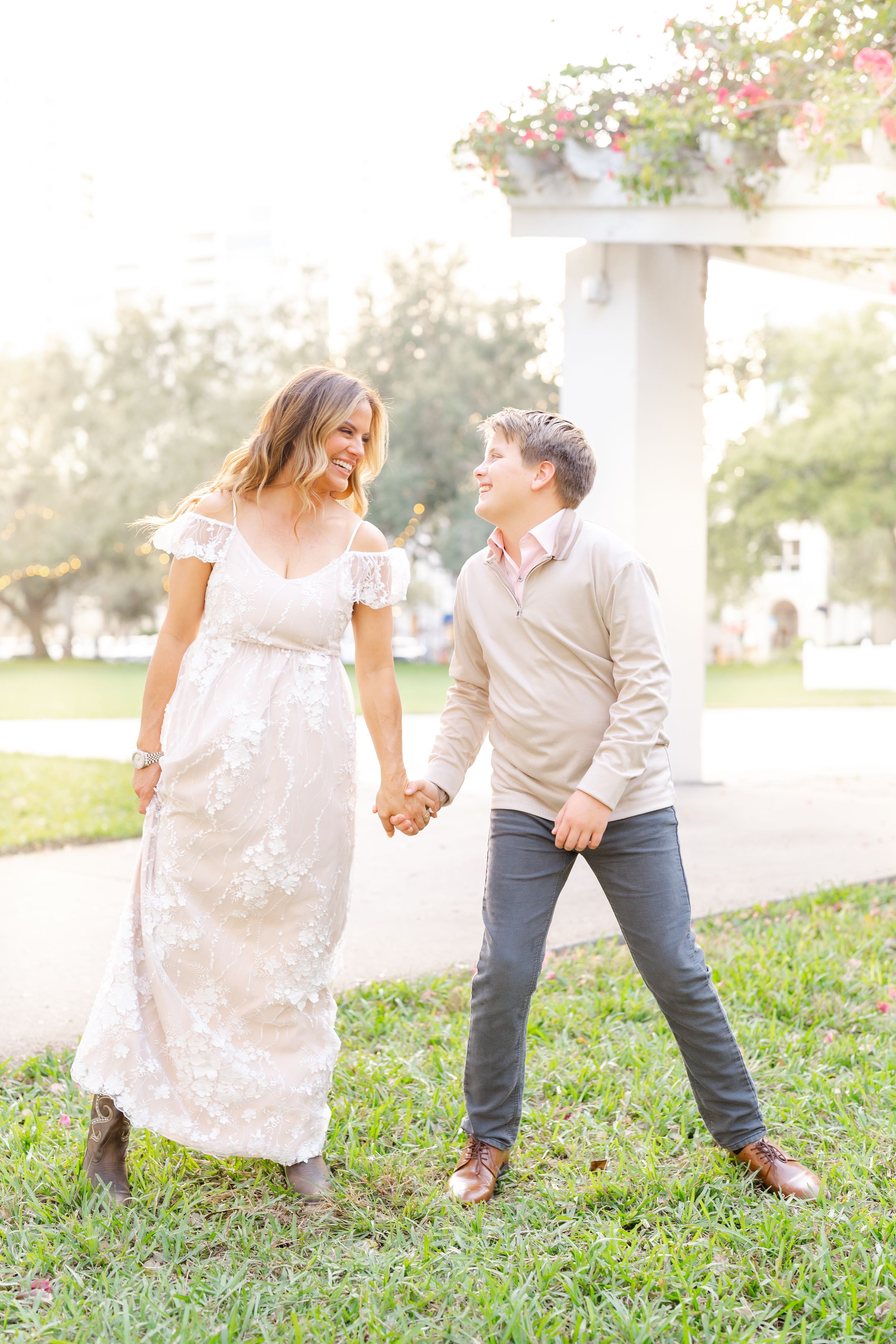 mother and son cuddling together with big smiles at The Vinoy in St. Pete FL during their family photoshoot.