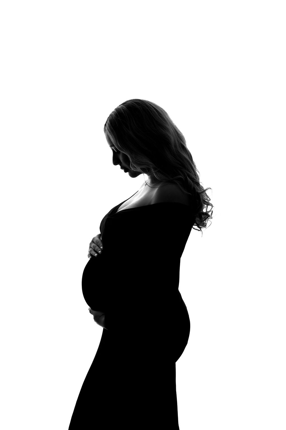 Silhouette series of a pregnant woman's growing belly showing progression of pregnancy through multiple profile views.