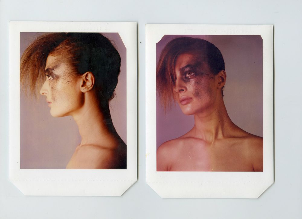 Two vintage Polaroid photos of a person with short hair, one profile view and one front-facing with dramatic makeup.