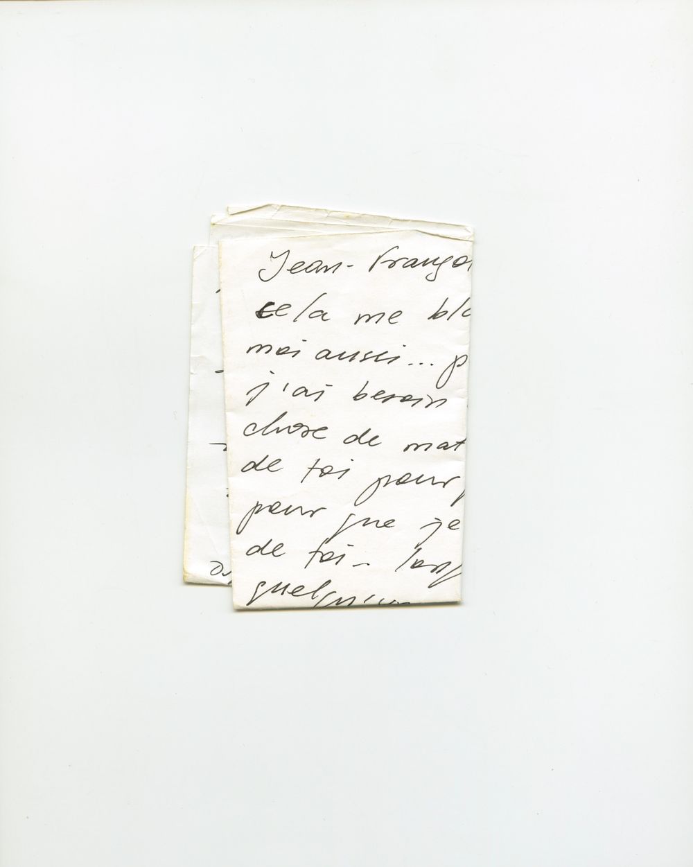 Handwritten French letter on folded paper beginning with "Jean-François", written in cursive black ink.