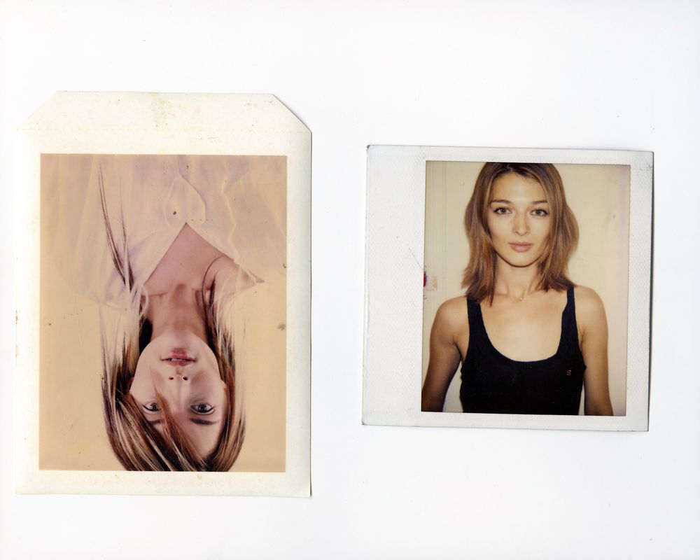 Two Polaroid photos side by side, one upside down showing a woman, the other showing a young woman in a black tank top.
