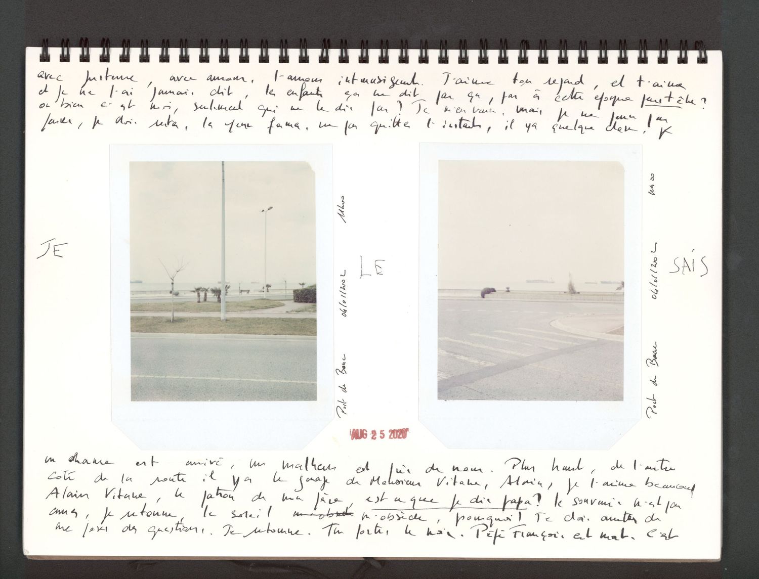 A spiral-bound journal with handwritten notes and two small photographs of flat landscapes pasted on its pages.