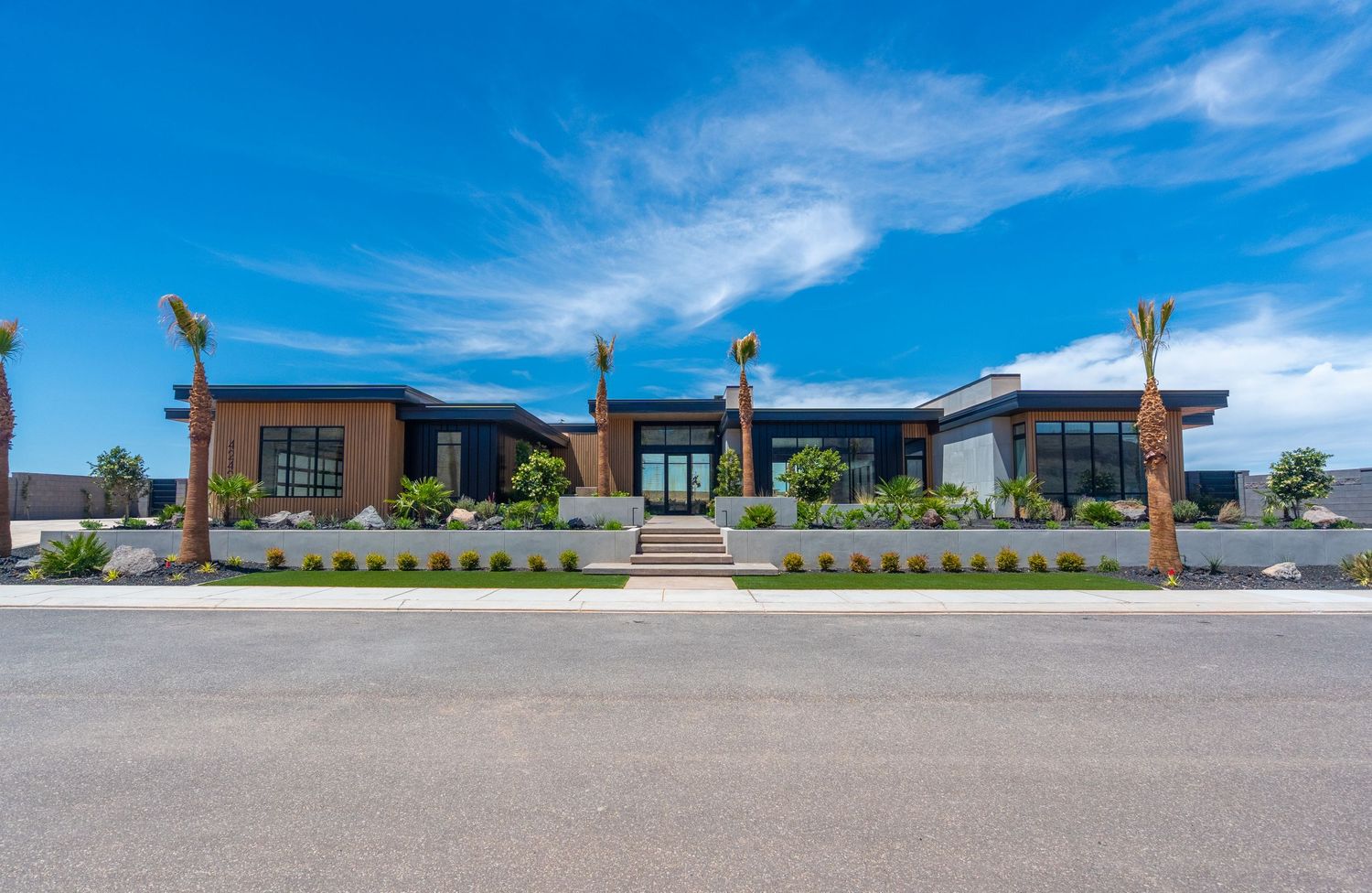 Aerial view of a modern Southern Utah home with pool and desert landscaping