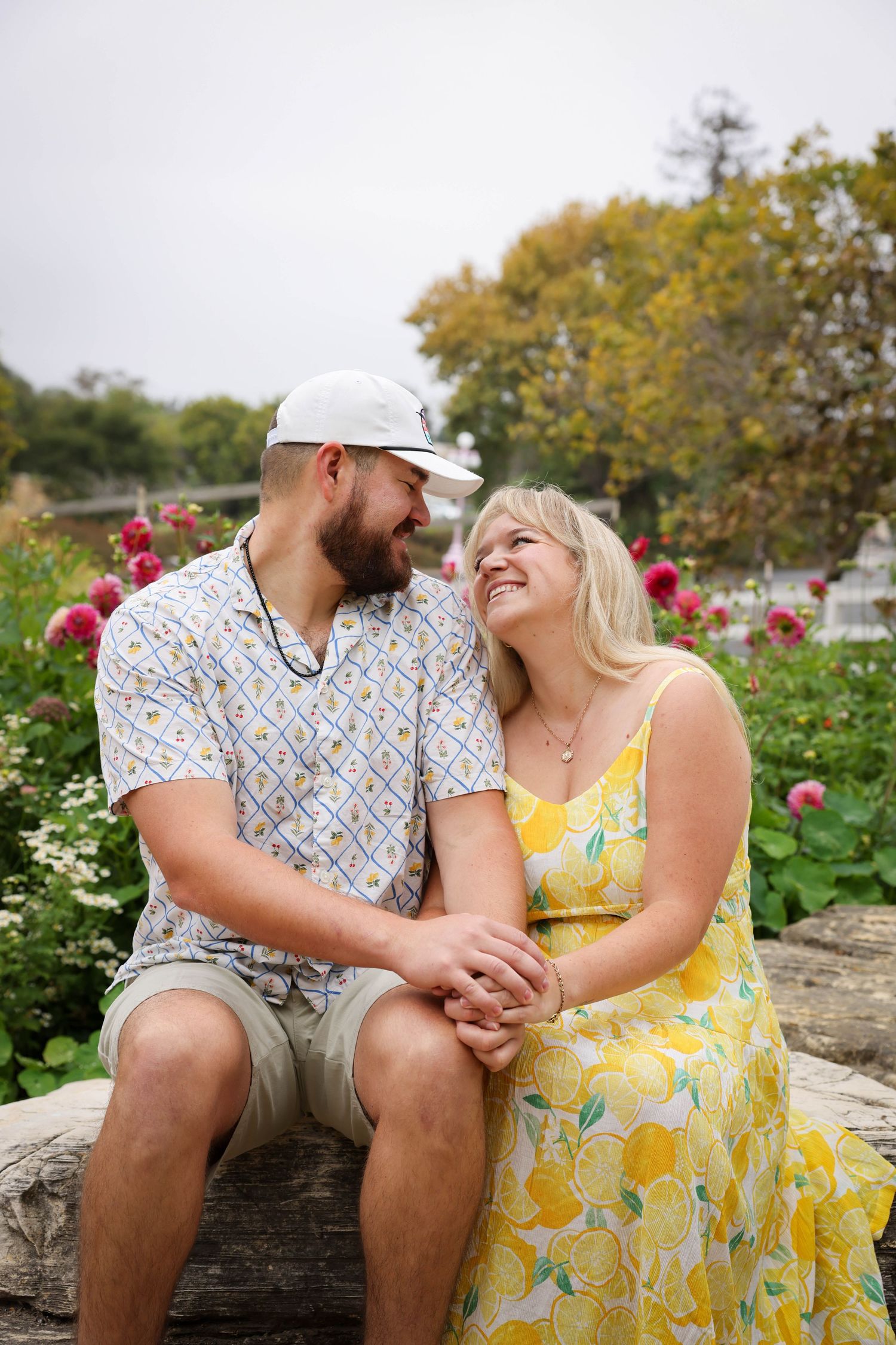 Couple looks lovingly into eachothers eyes in the Secret Garden at the Madonna Inn in San Luis Obispo