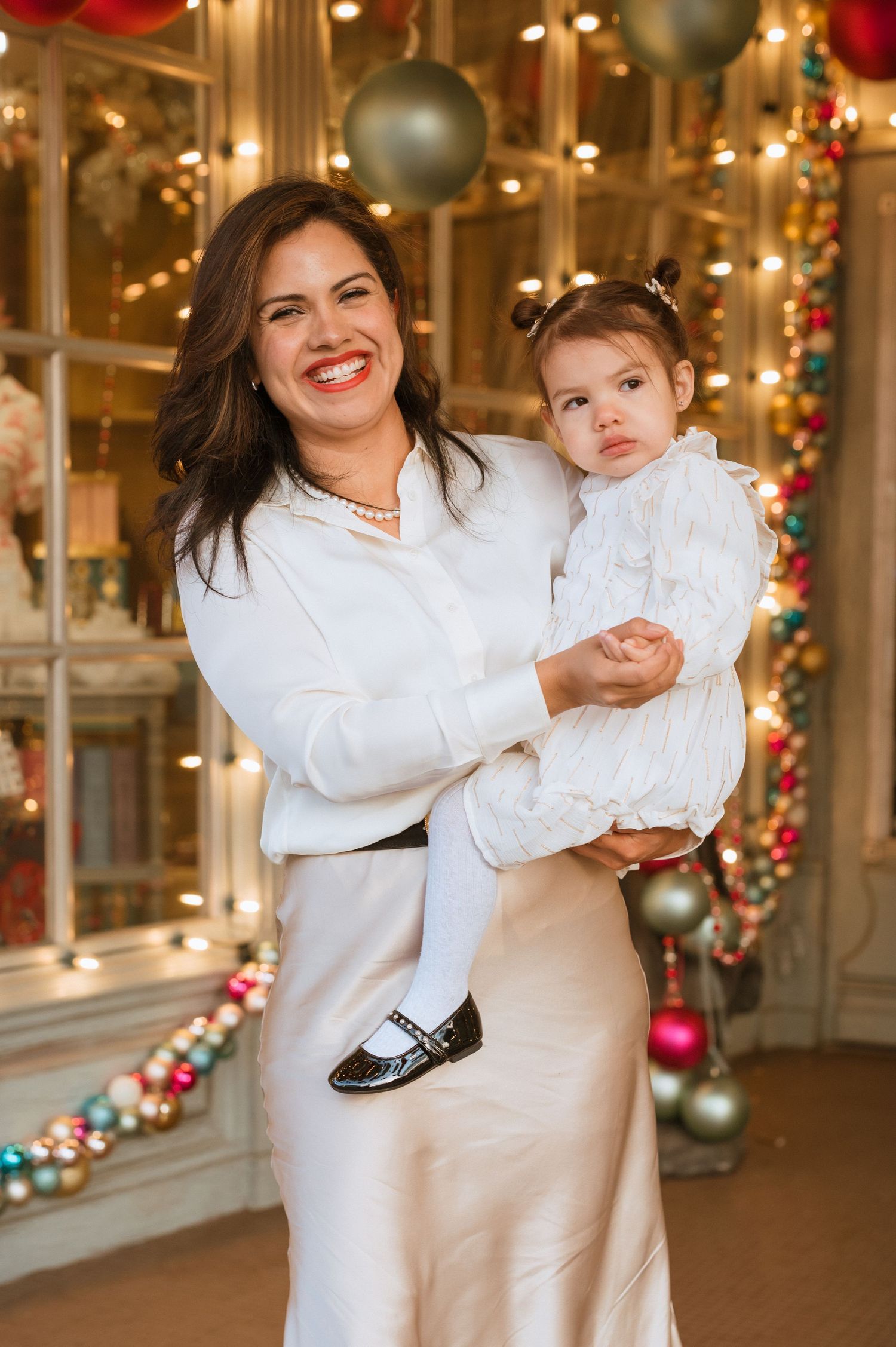 Family enjoying a Christmas photo session in Downtown McKinney