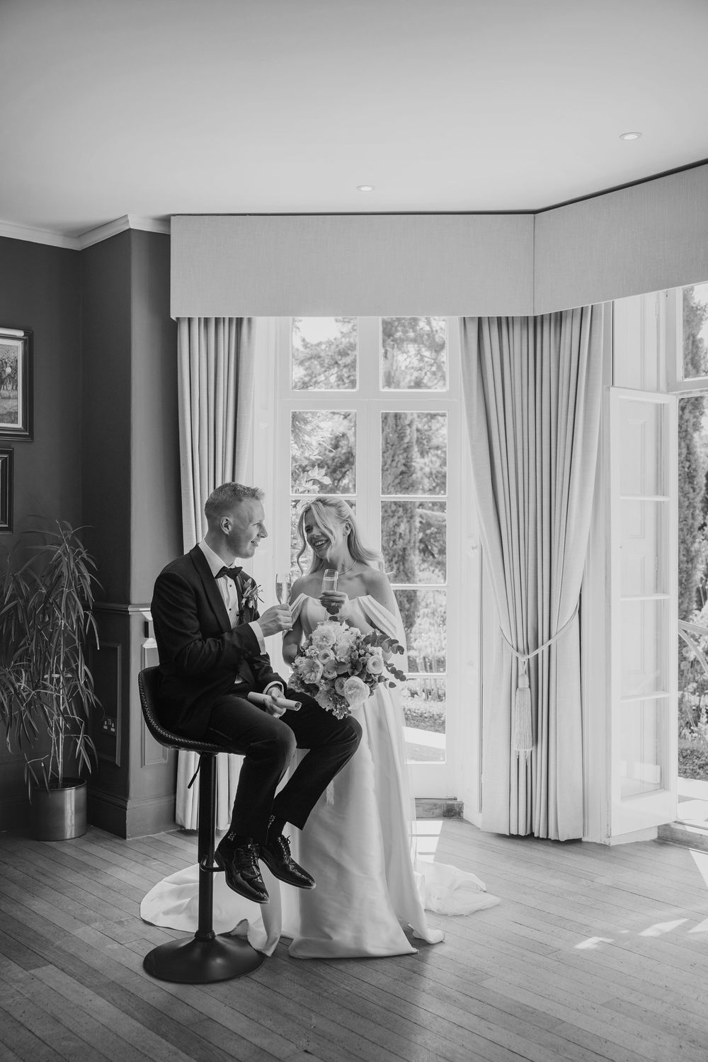 Bride and Groom enjoying champagne at Deer Park Country House in Devon