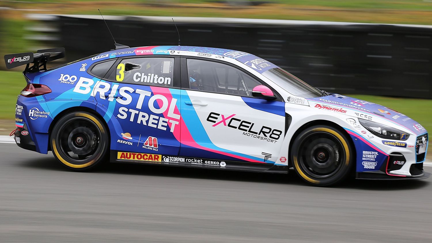Tom Chilton races a blue Bristol Street Motors EXCELR8 Hyundai number 3 at a BTCC motorsport event.