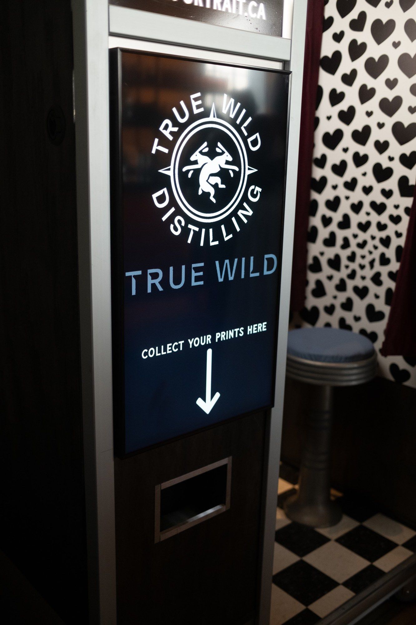Branded photo booth screen for True Wild Distilling wedding, Calgary