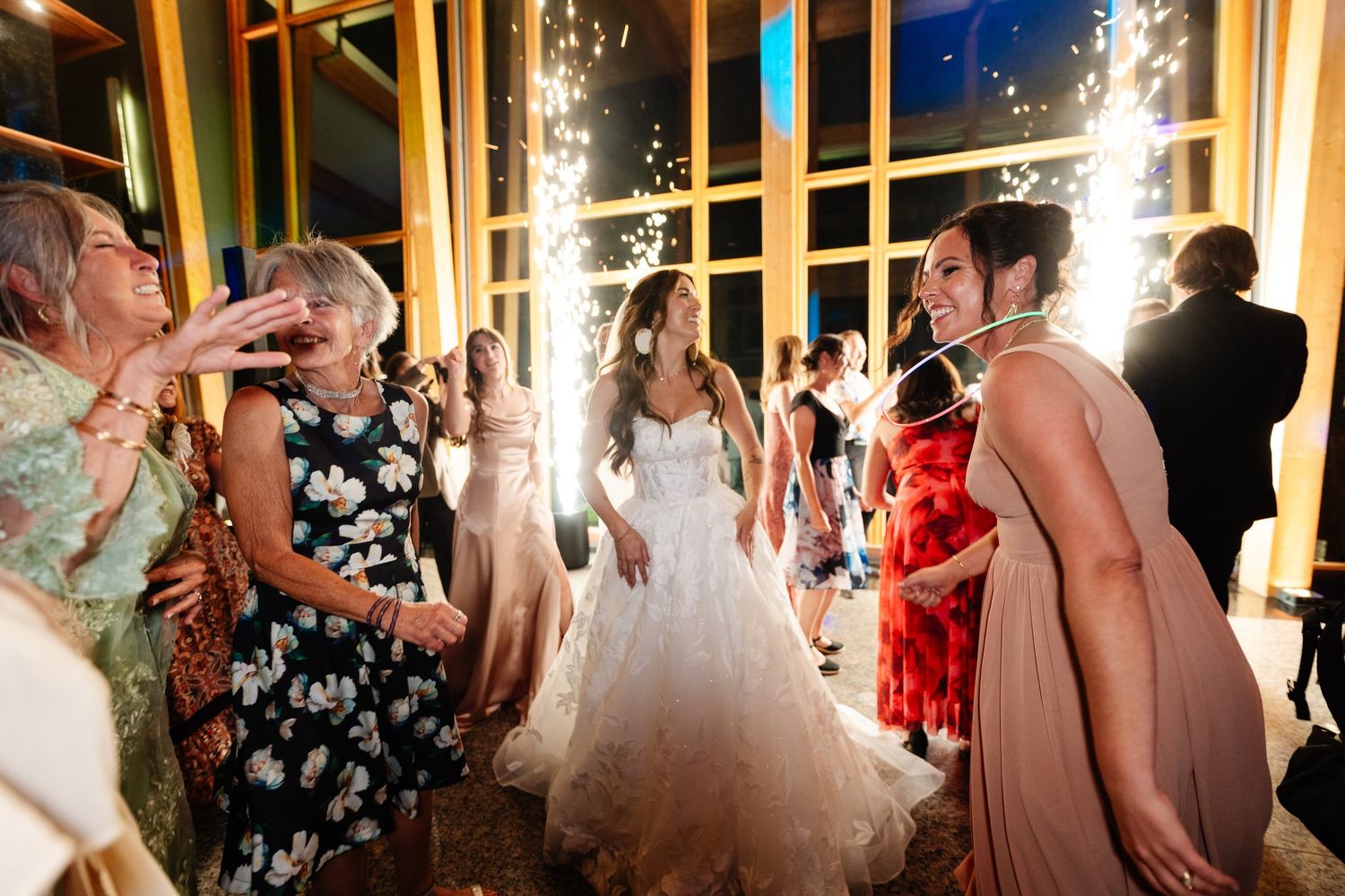 Wedding party dancing with sparklers at Azuridge reception