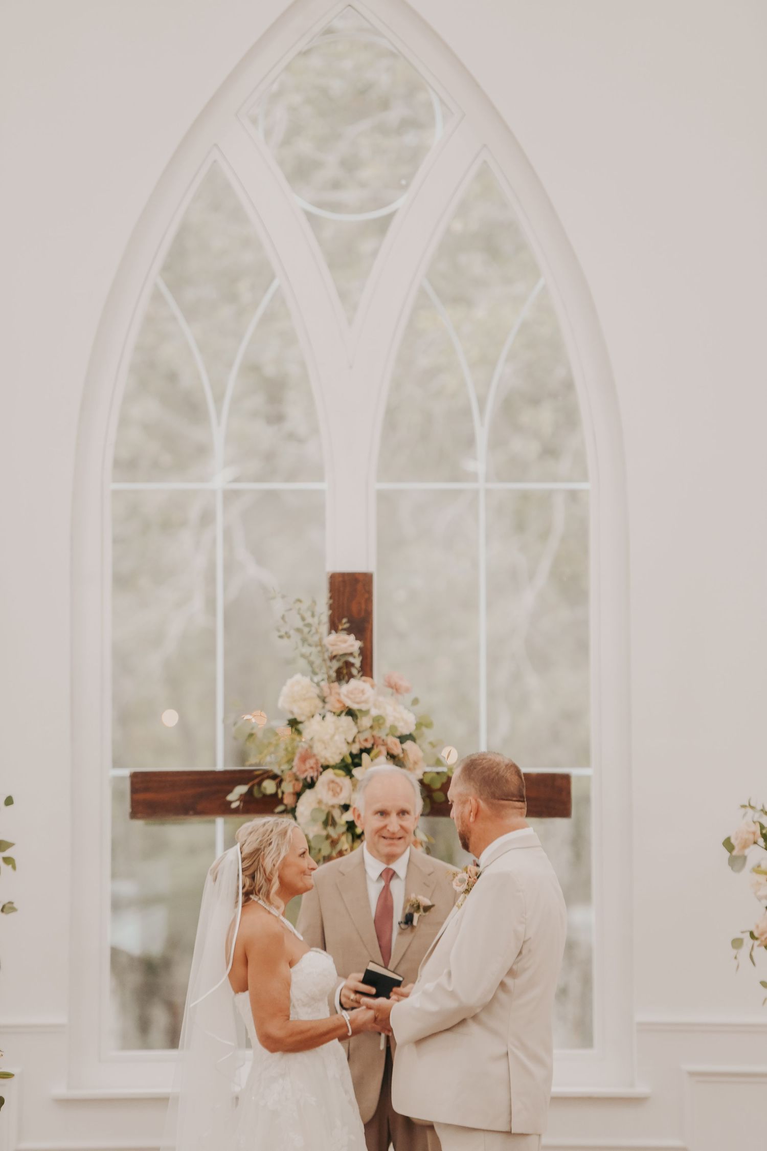 Bride and groom surrounded by their children and grandchildren on their wedding day