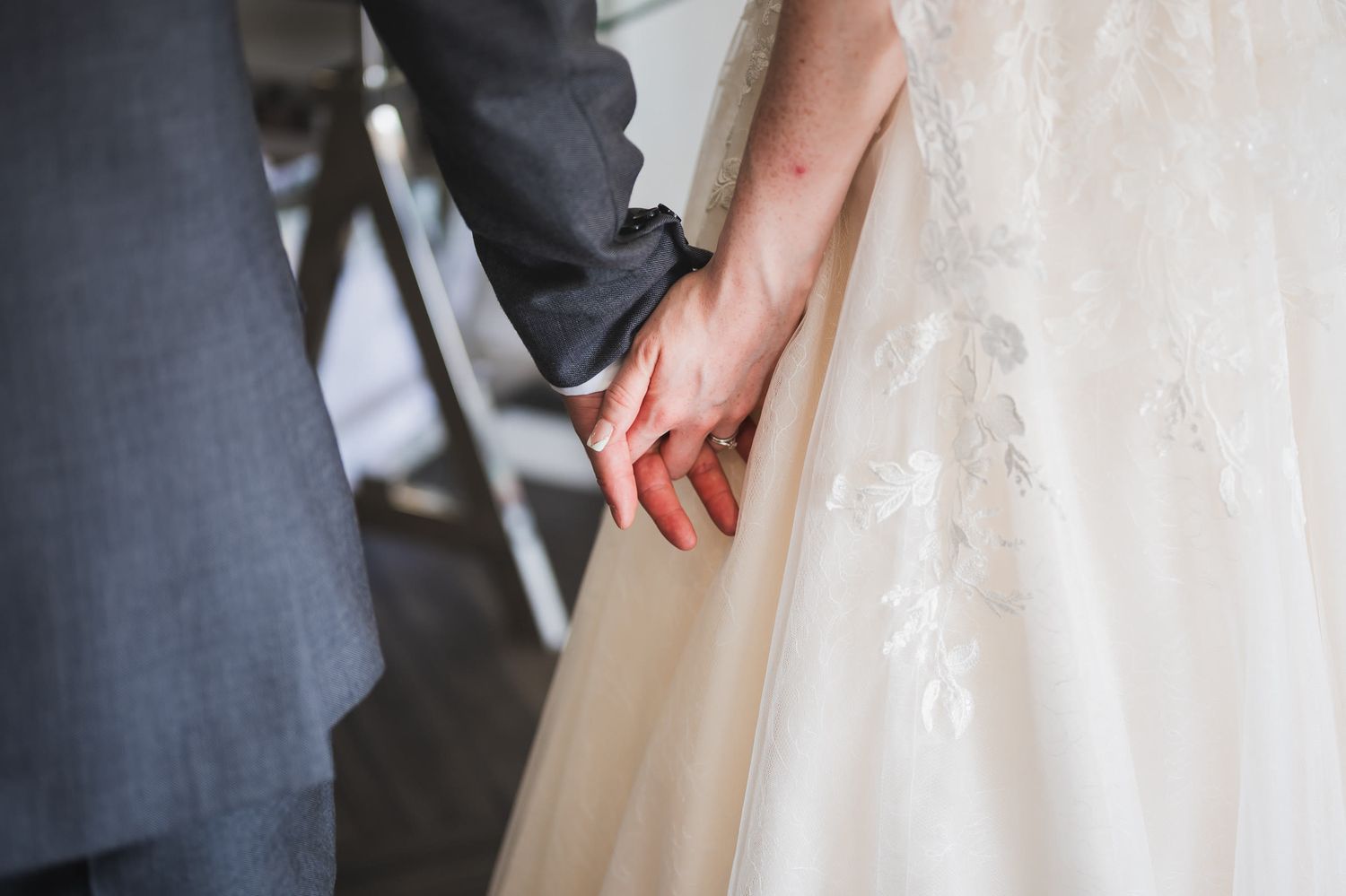 Charlotte and Niall holding hands, Merrydale Manor wedding photography, Cheshire
