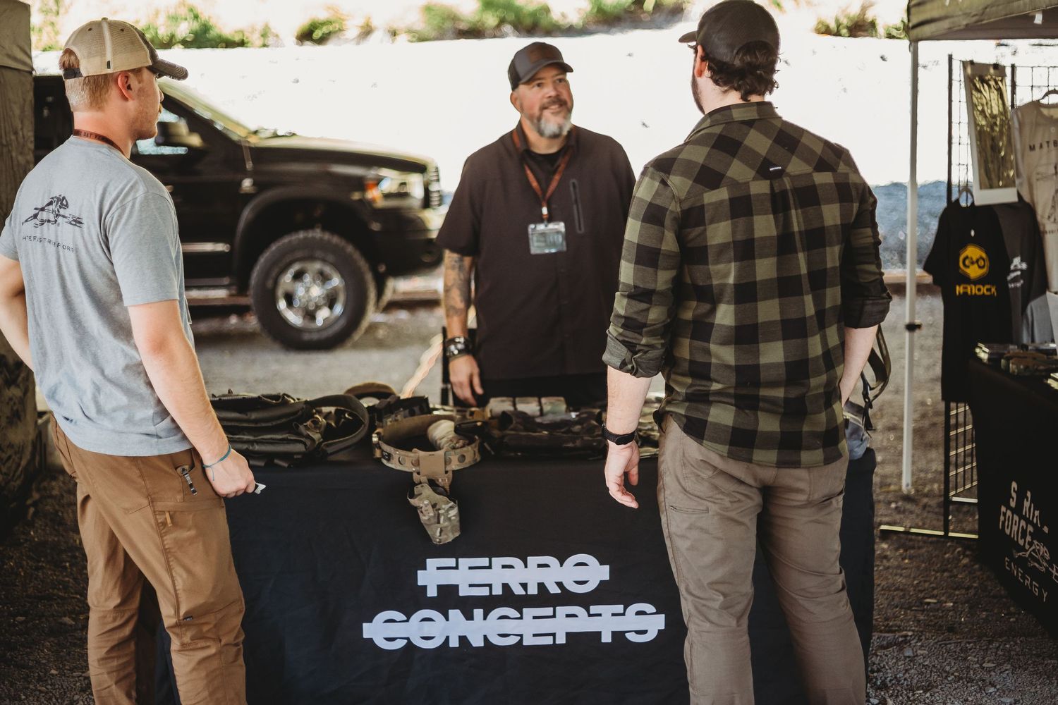 Tactical brand owners talking with each other at the Ferro Concepts booth at an industry event in West Virginia for Appalachian Range Day