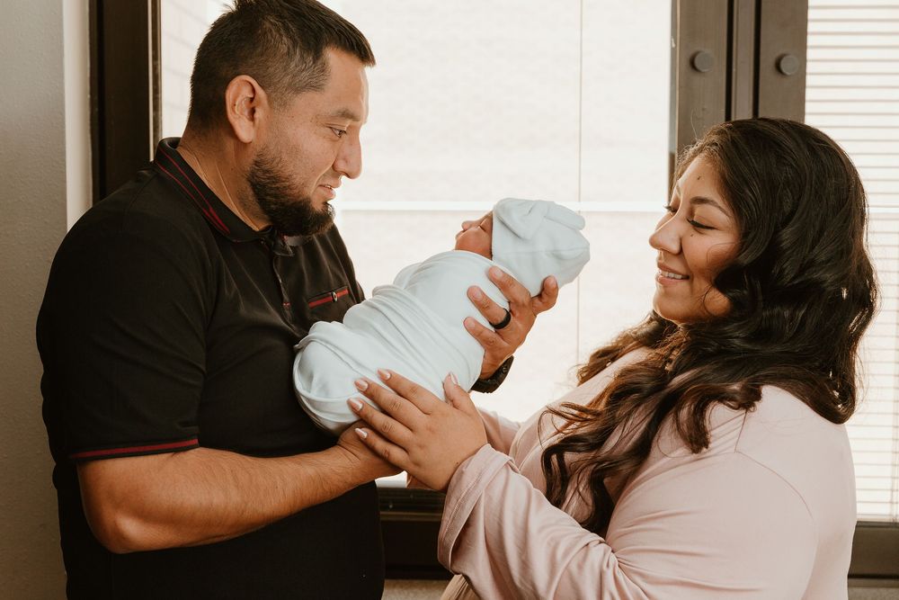 Mom and dad with newborn baby in fresh 48 session in East  Tx Hospital room