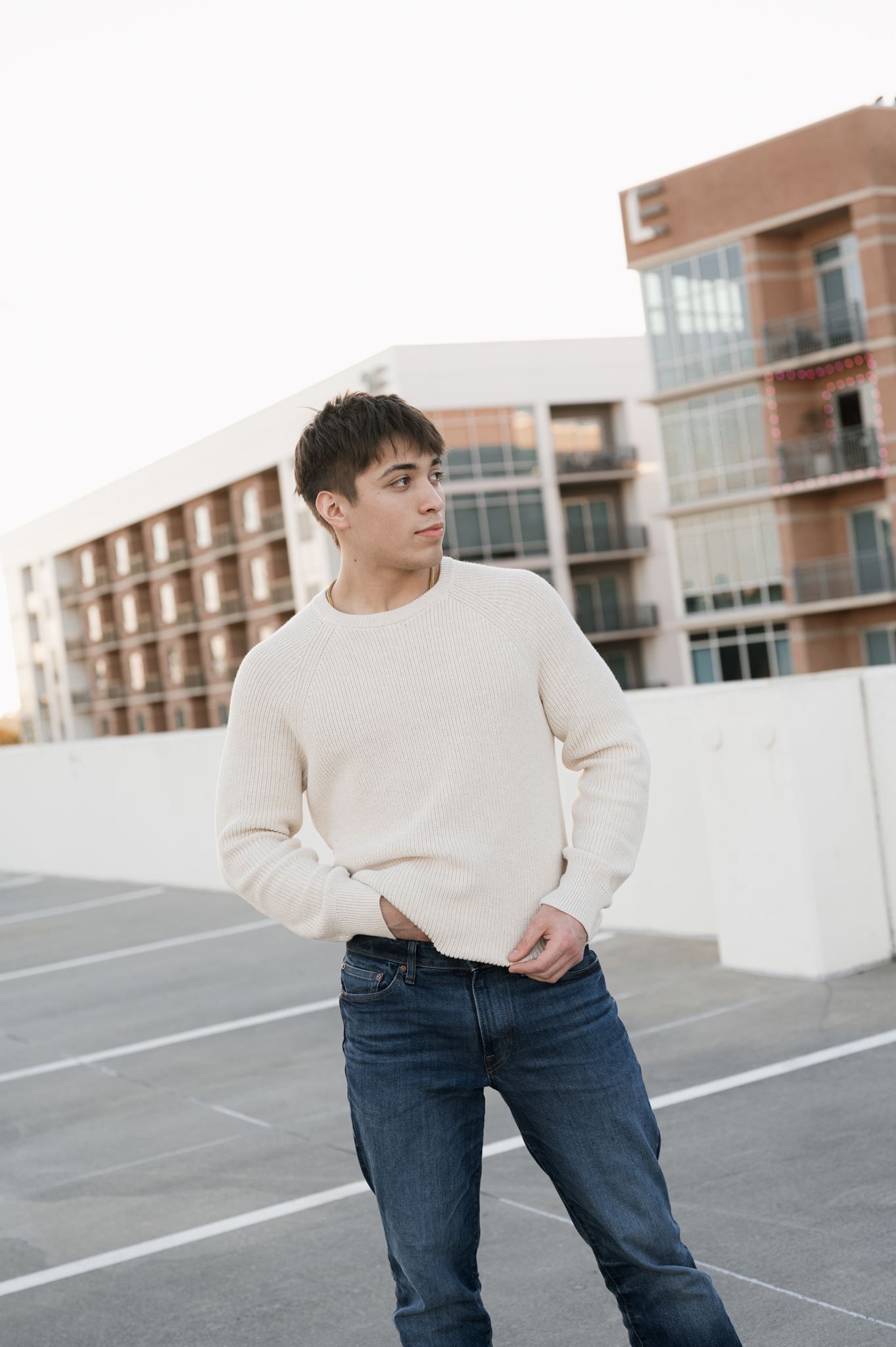 College Park HS senior posing on garage rooftop for senior pictures.