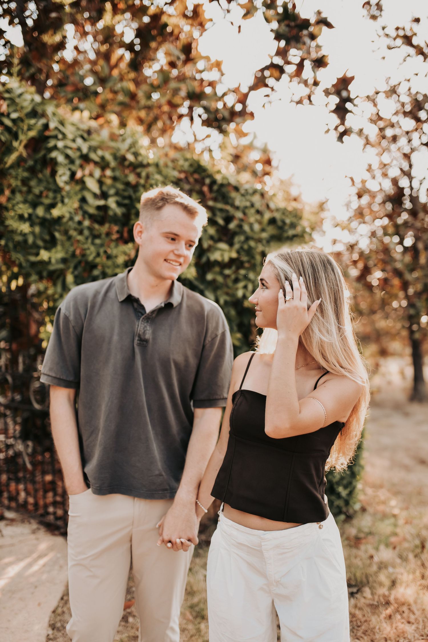 Newly engaged couple celebrating after a surprise proposal