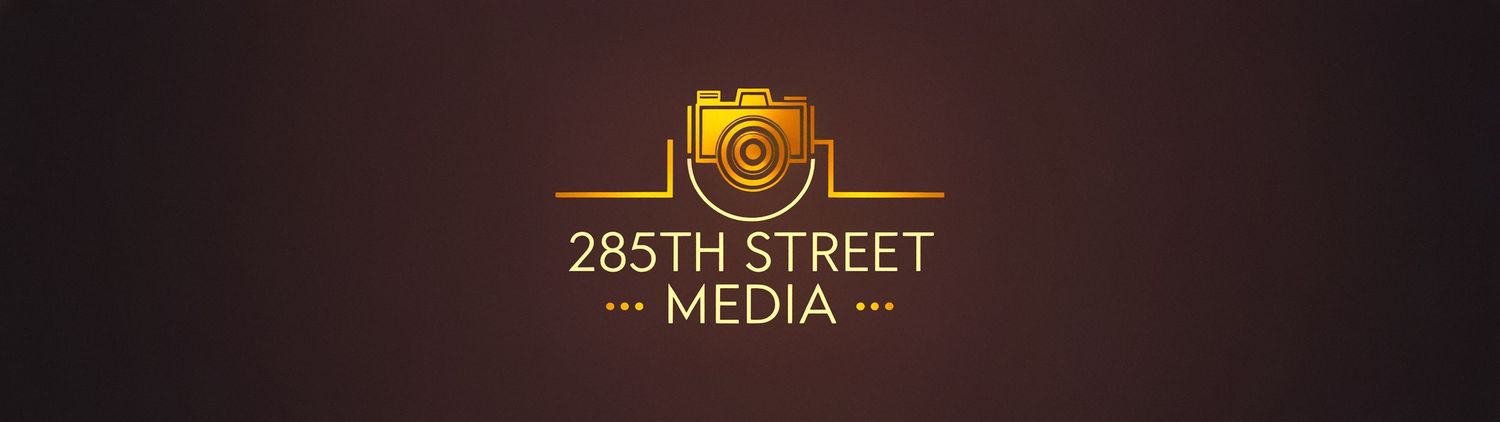 Gold camera logo for 285th Street Media on a dark brown background.