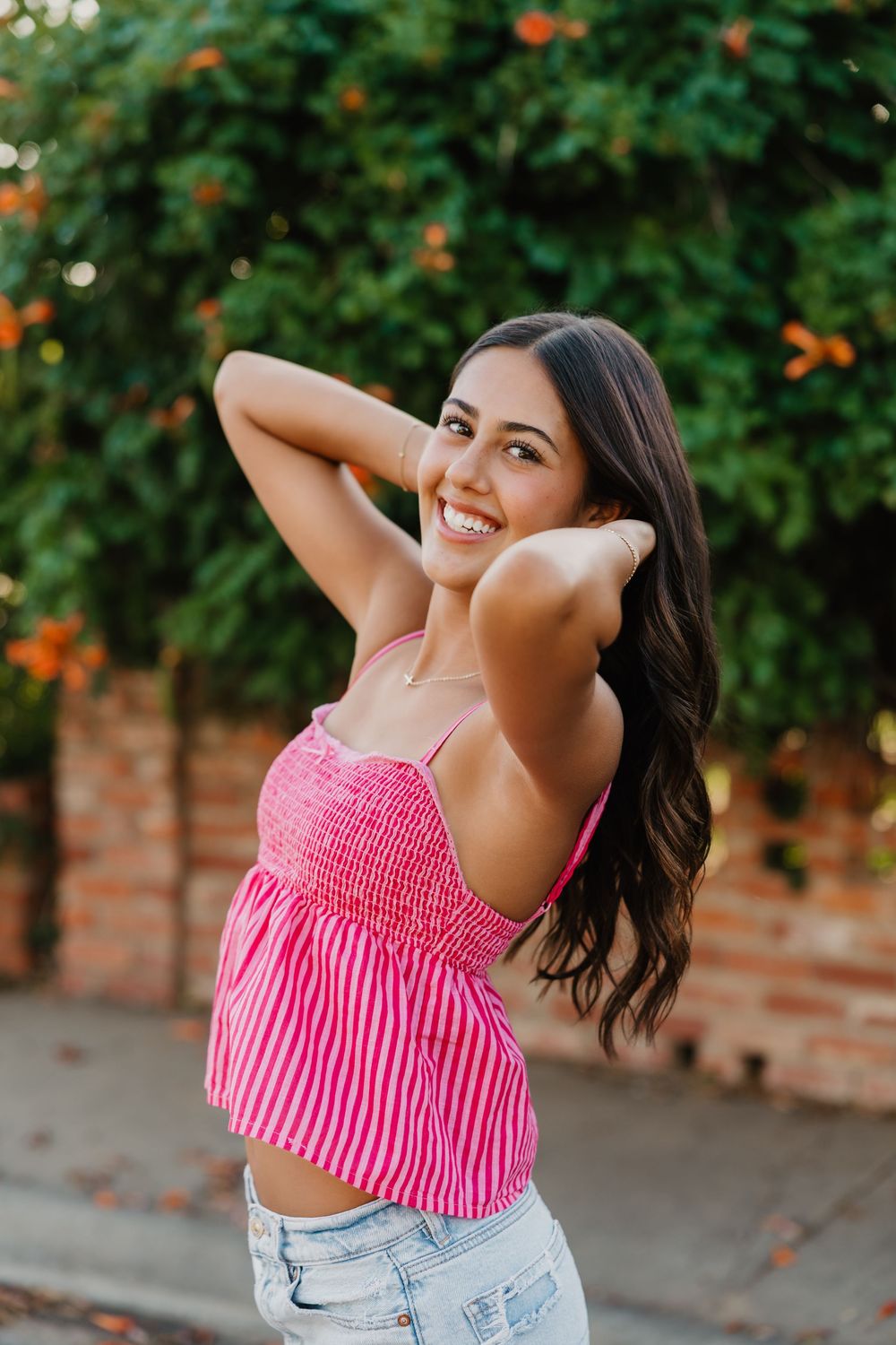 Senior girl taking portraits in Tulia Texas in fun outfit outdoors