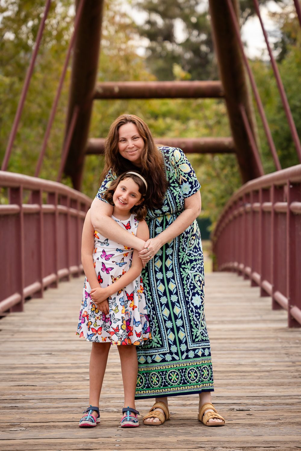 Bay Area family poses on a bridge at Vasona in Los Gatos