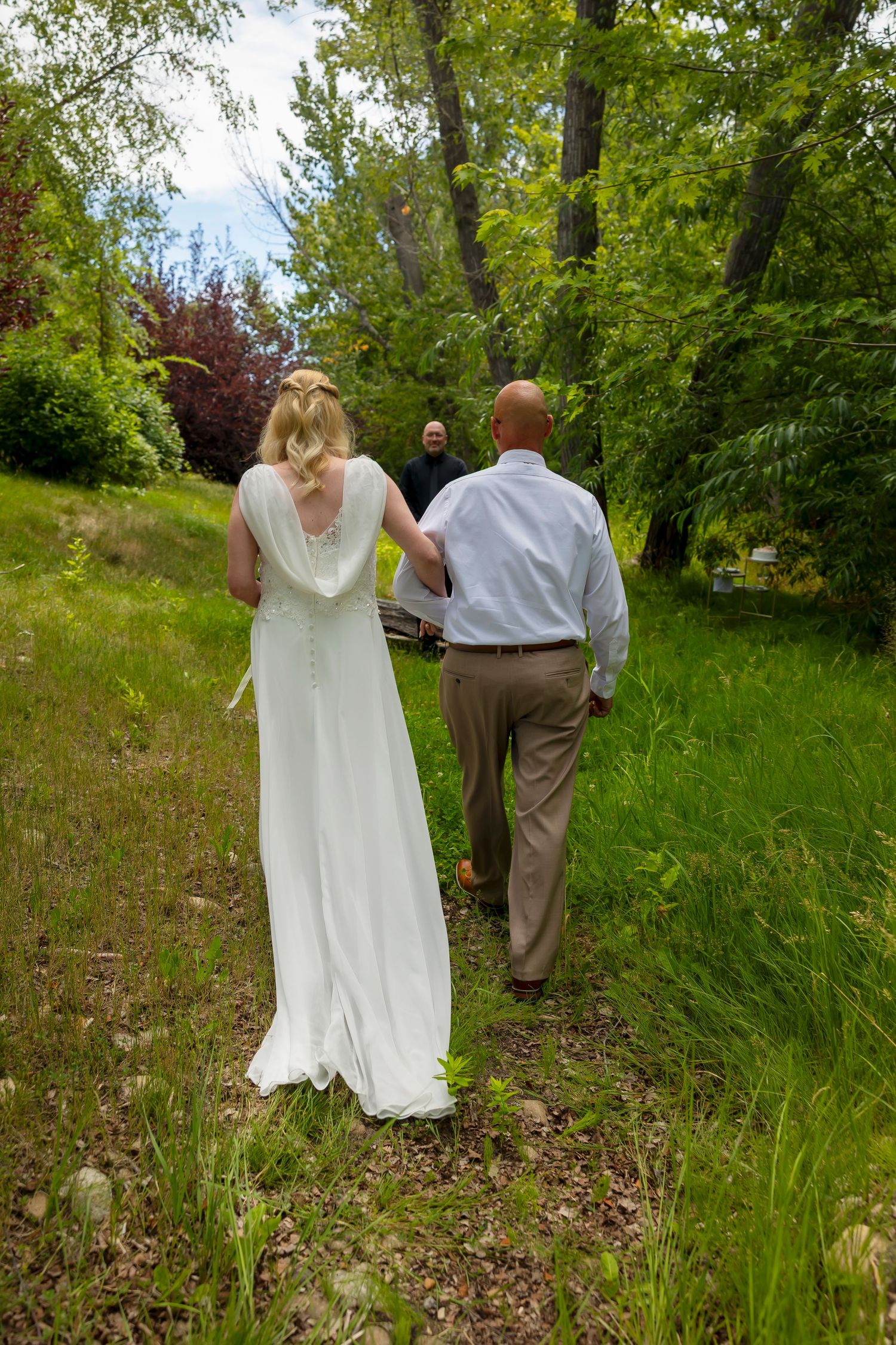 bride and groom walking down aisle together toward Milestones Union officiant Boise Elopement ©Milestones Studios LLC