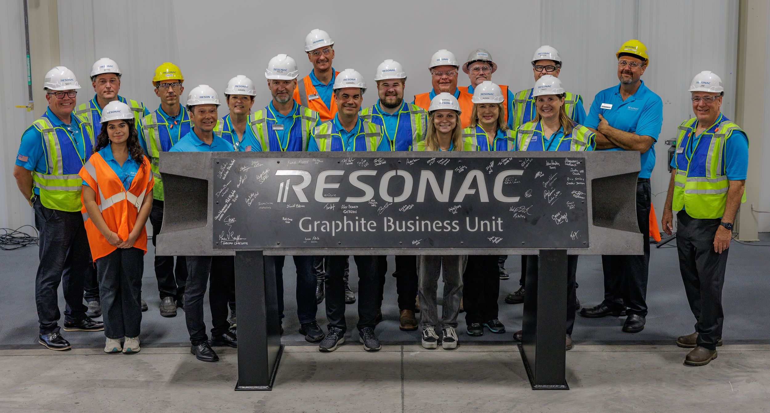 Industrial workers in protective equipment gathered at a Resonac facility.