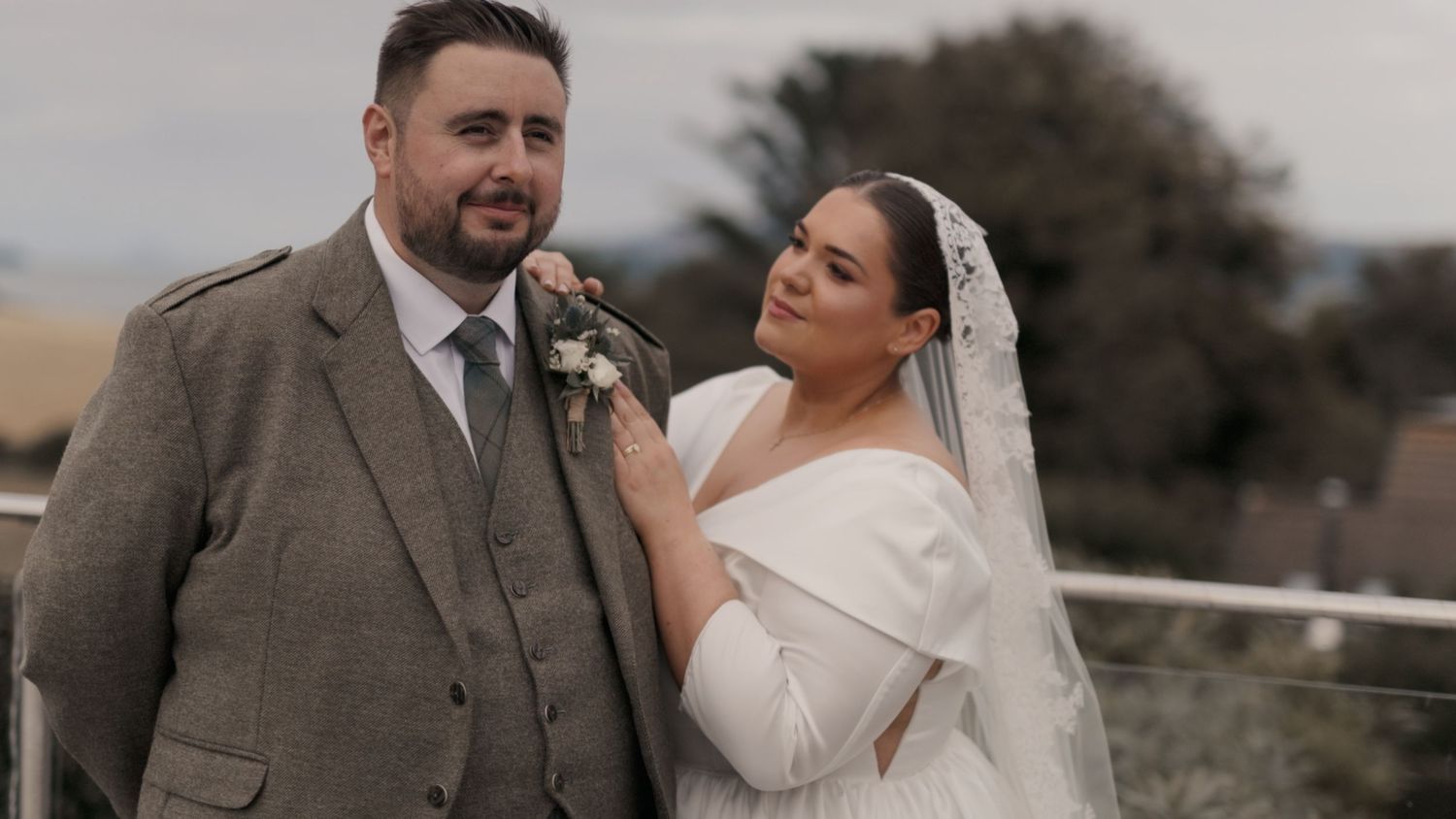 Bride and groom standing holding each other lovingly in Stranraer, Dumfries and Galloway