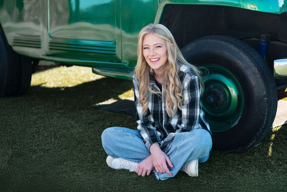 High school senior portrait by a vintage truck
