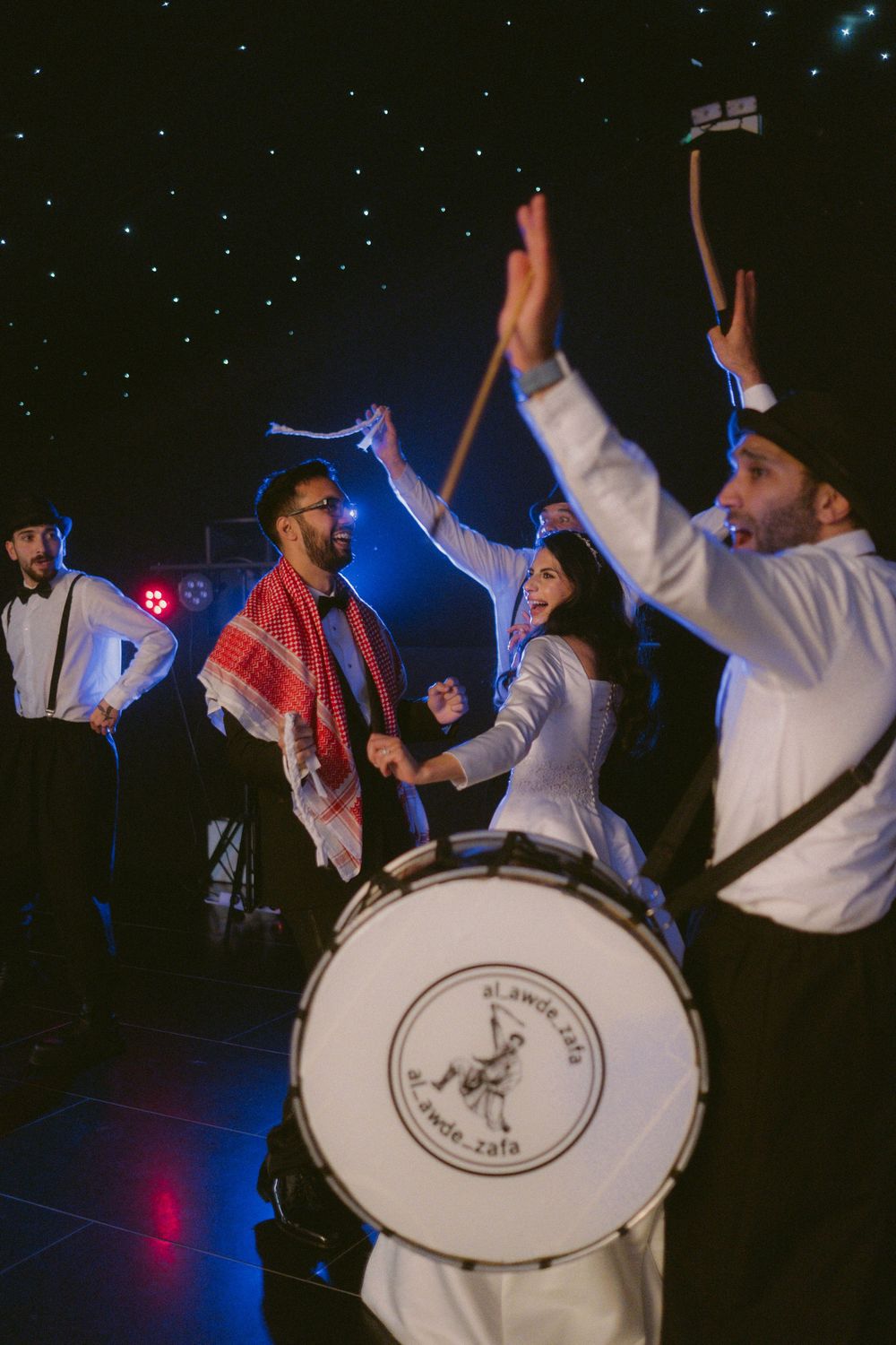 Documentary style photo of dabke band during wedding entrance