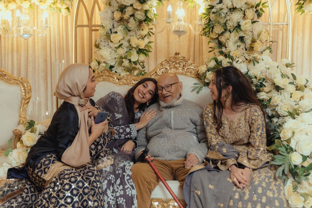 Candid photo of bridal party and grandad