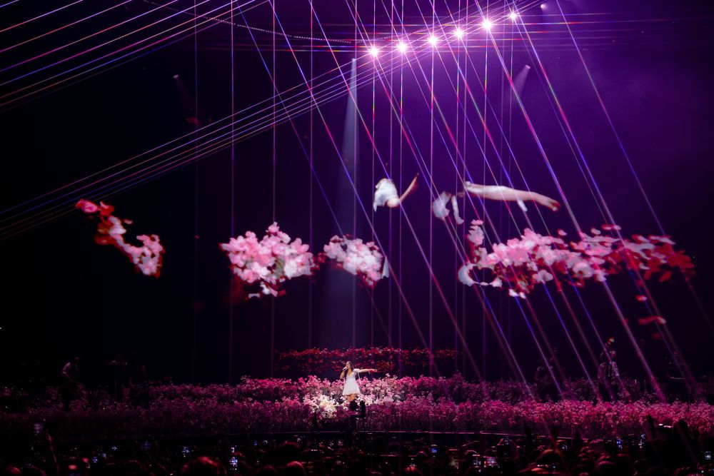 Wide view of Olivia Rodrigo and her band performing before the crowd during opening night of the Unraveled Tour at PeoplesBank Arena