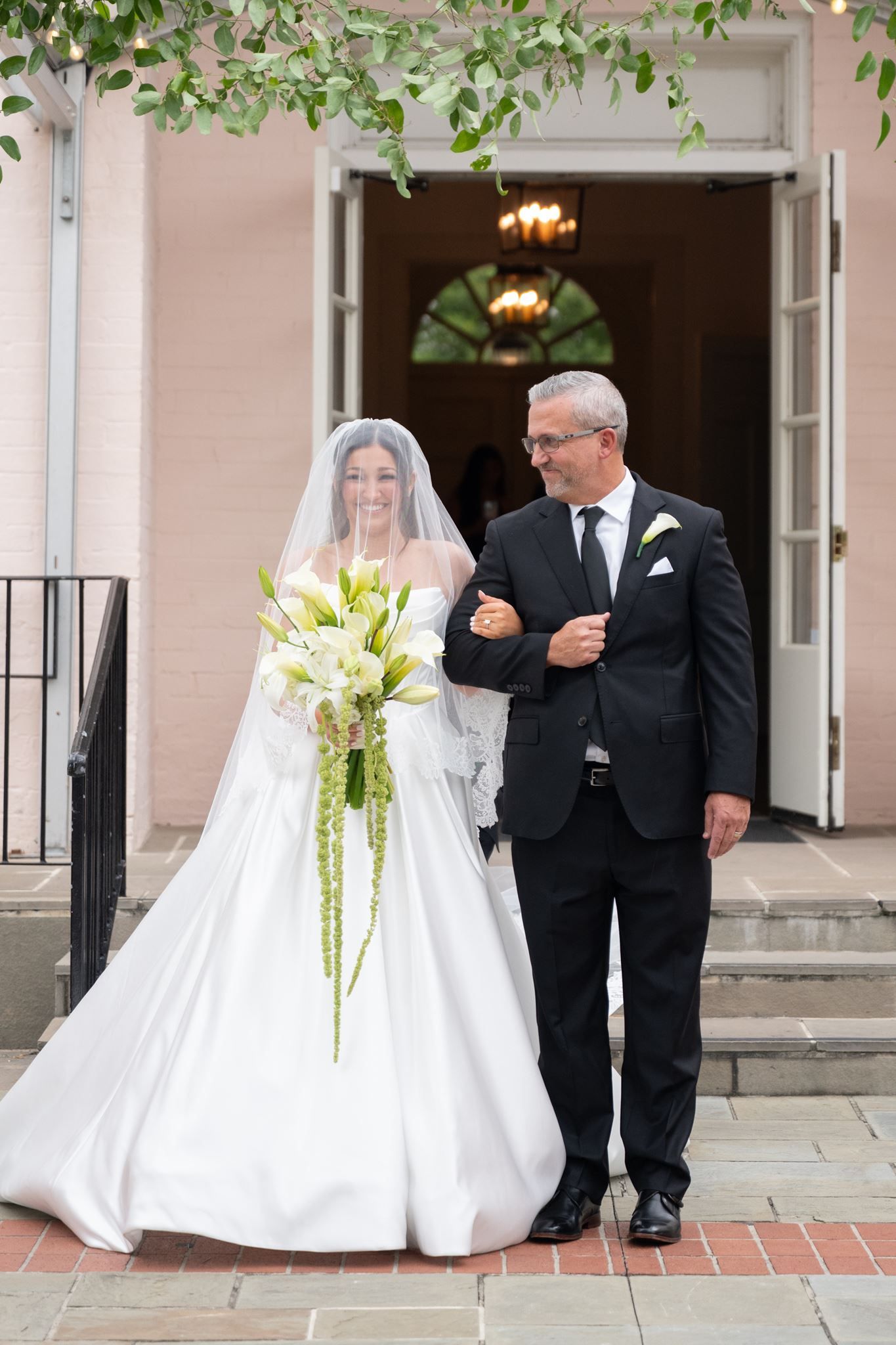 Bride and her father walking down the aisle.