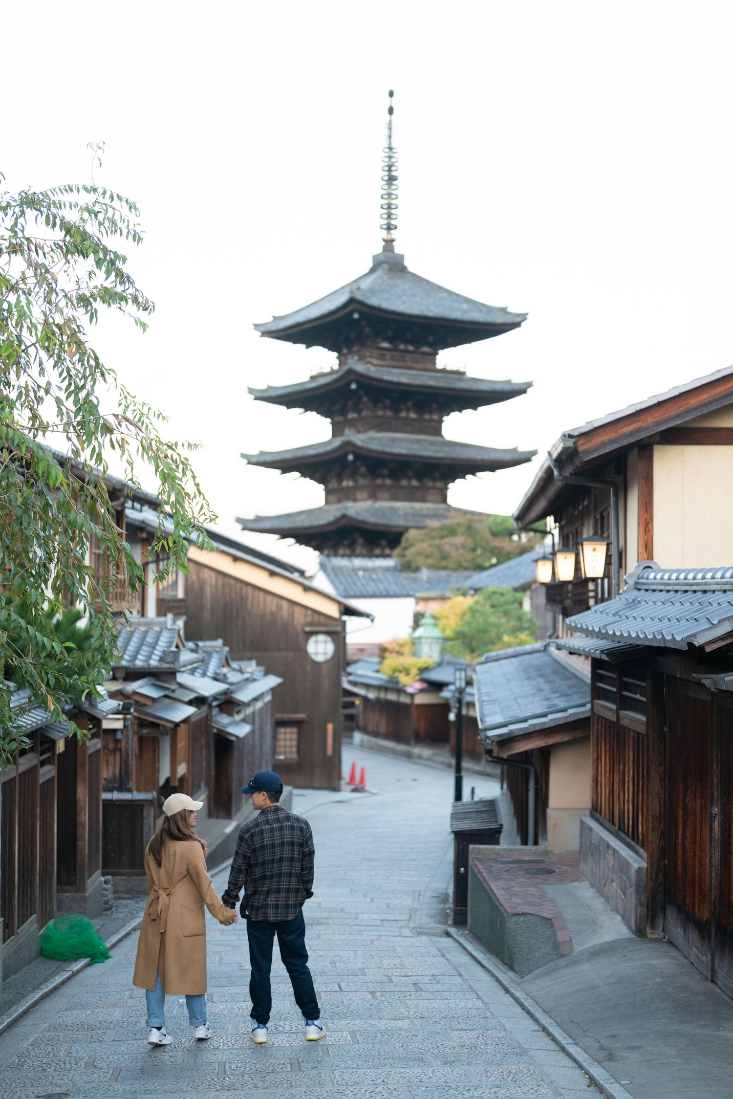 Traditional Japanese Zen rock garden with raked gravel patterns and stones at a Kyoto temple.
