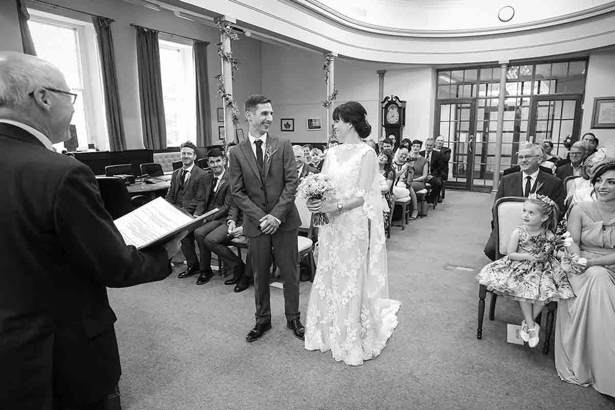 Exchanging wedding vows before a registrar at Cockermouth town hall.