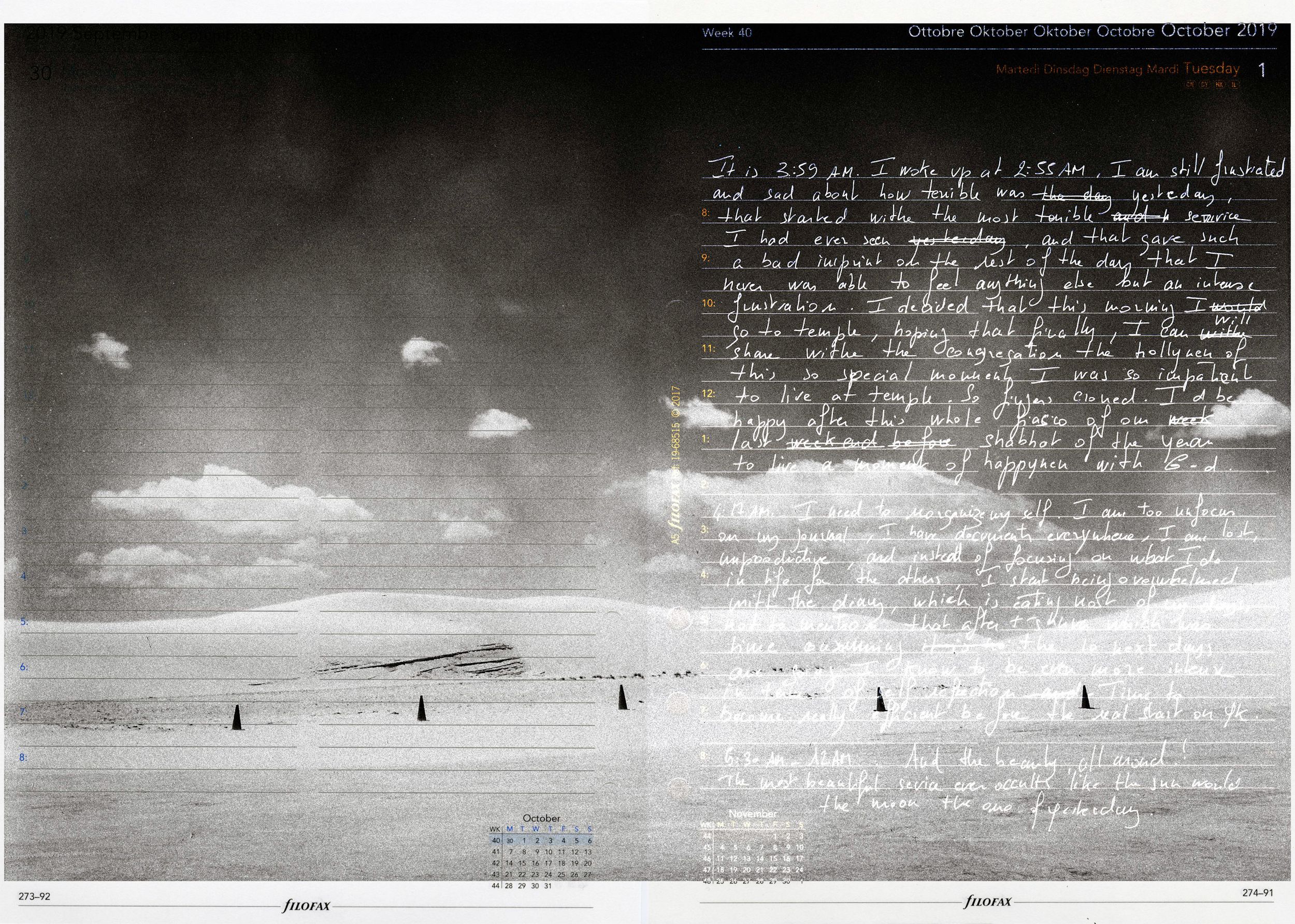 Surreal black and white landscape with handwritten text overlay and floating clouds above a barren plain.