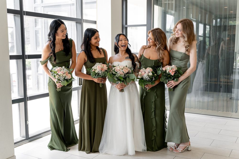asian wedding photography, brides having fun doing candid group photos