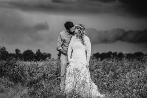 bride and groom in long grass