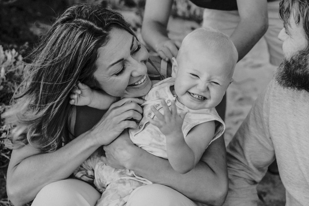 laughing baby with mum