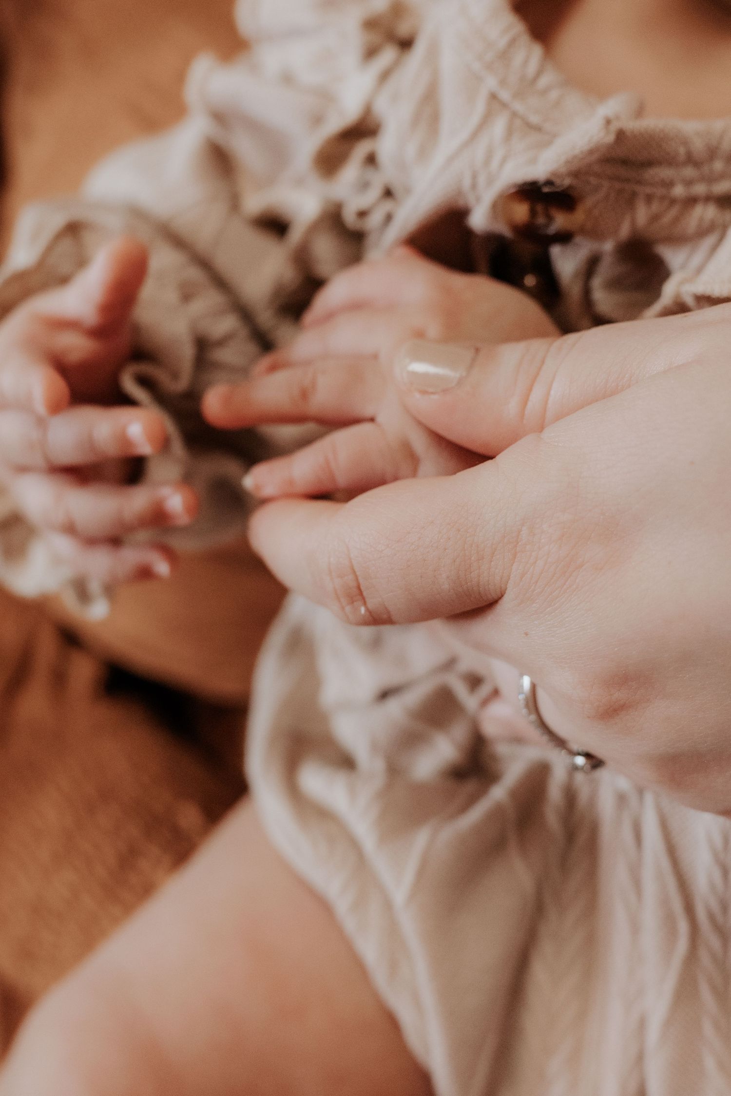 Close up detail shots of delicate lace fabric and hands.