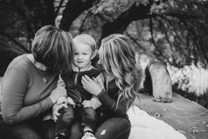 Intimate black and white grandma, mom, and son moment captured outdoors in Richland, Washington.