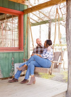 Romantic sequence of couple relaxing on wooden porch in casual attire.