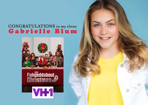 VH1 Full Frontal Christmas promotional image with performer in white jacket against blue background.