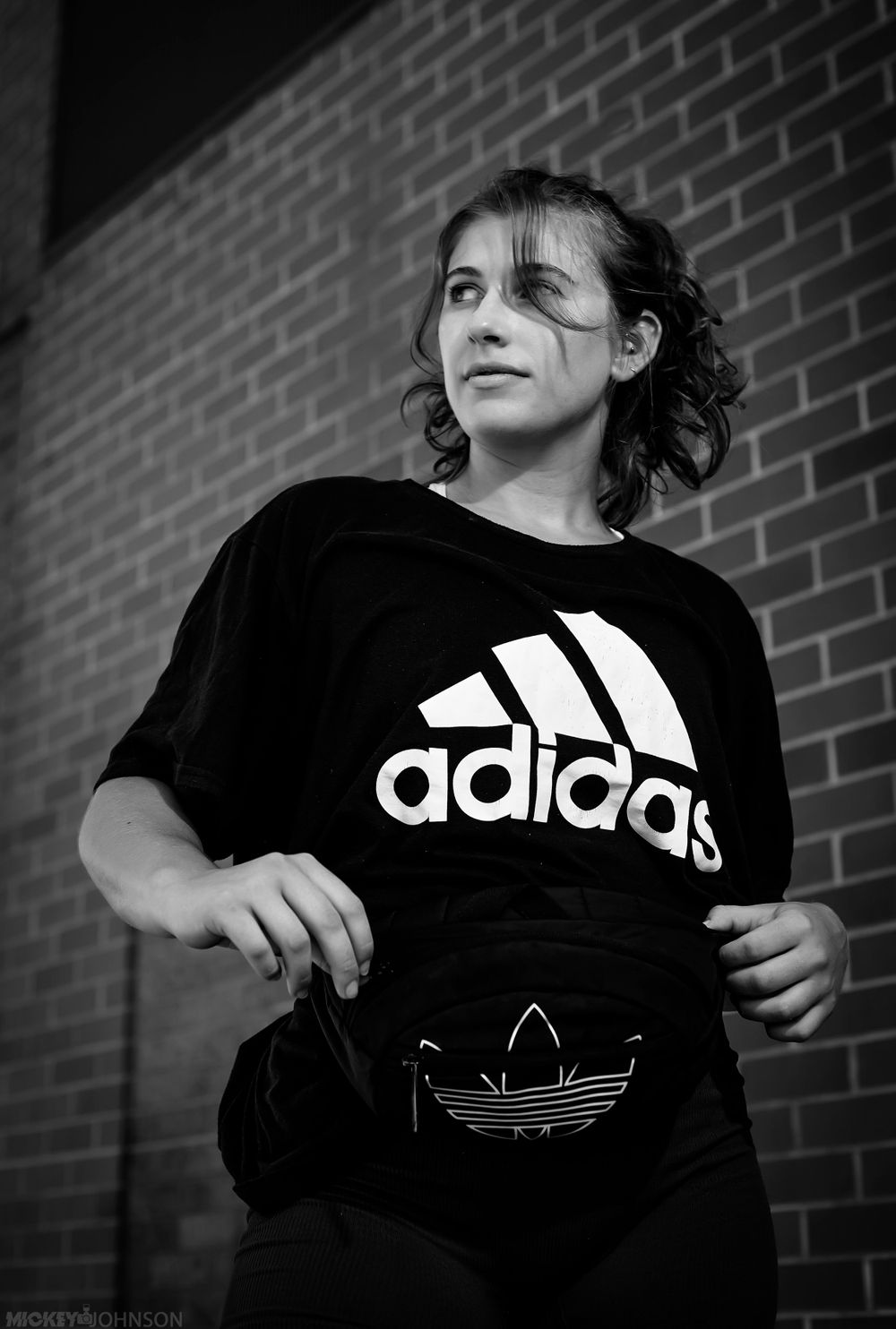 Black and white urban fashion shoot featuring Adidas branded clothing.