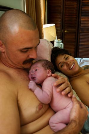Intimate skin-to-skin contact moments with a newborn baby.