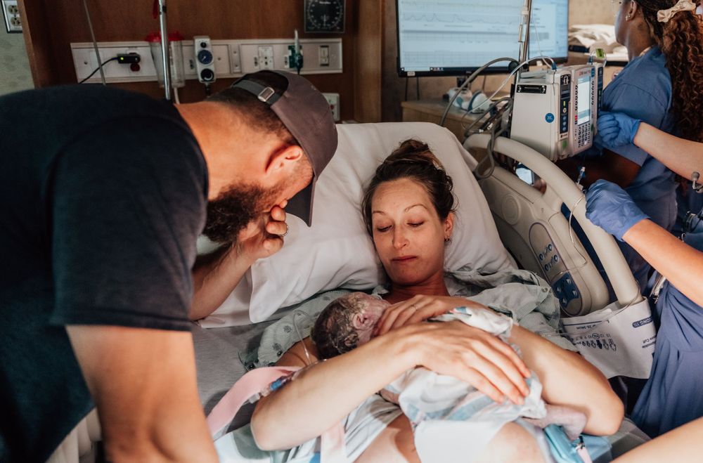Medical team provides support and care during hospital birth.