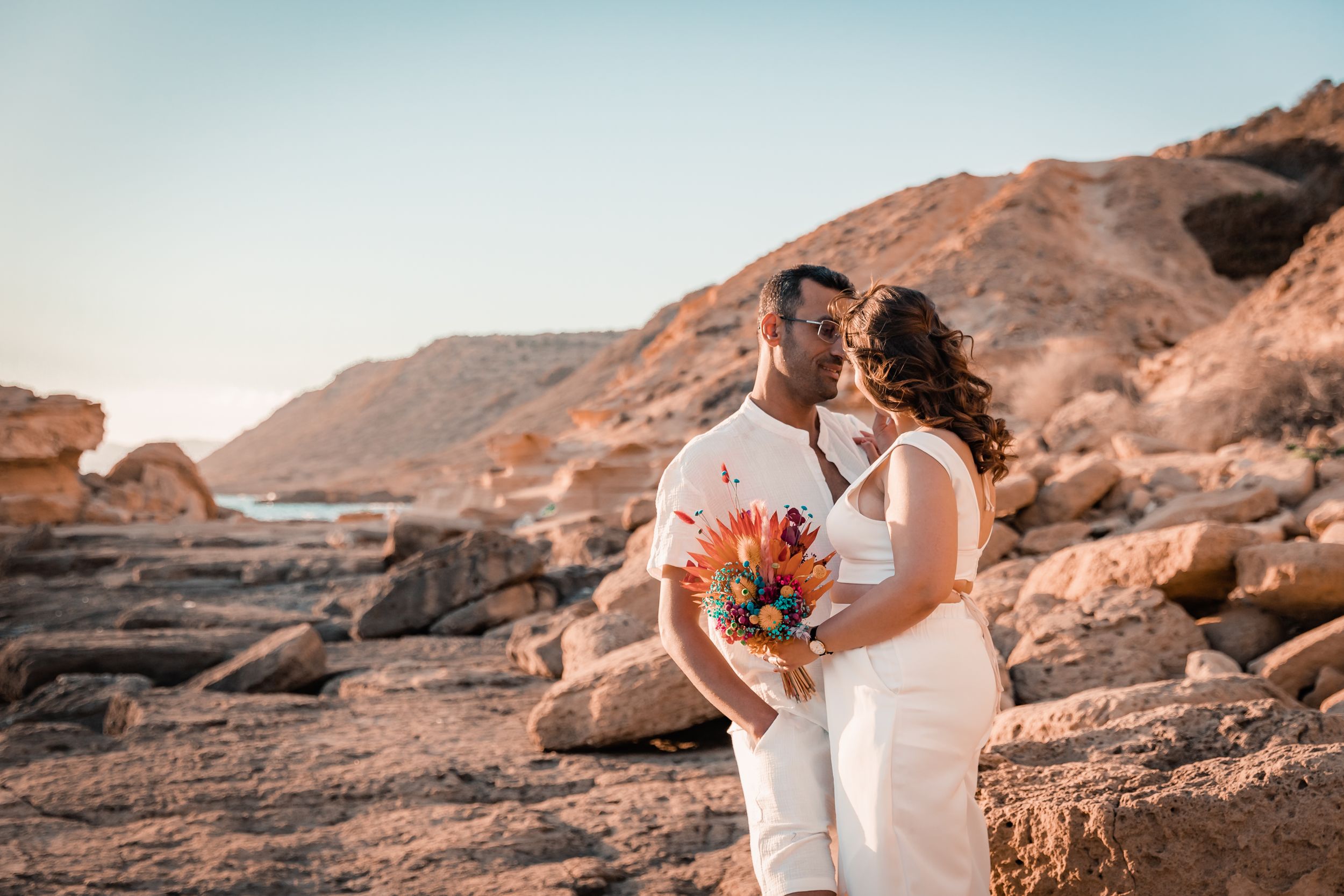 Mallorca engagement photoshoot on a rocky beach in Mallorca.