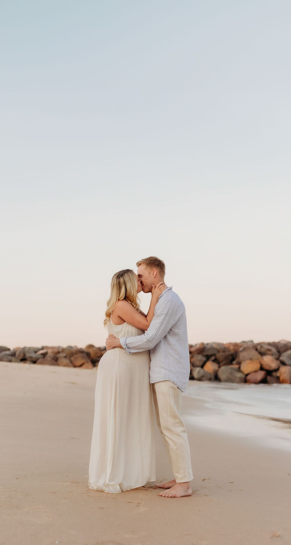 Charlotte Kate Photography. Maternity portrait/session, mum and dad cuddling.