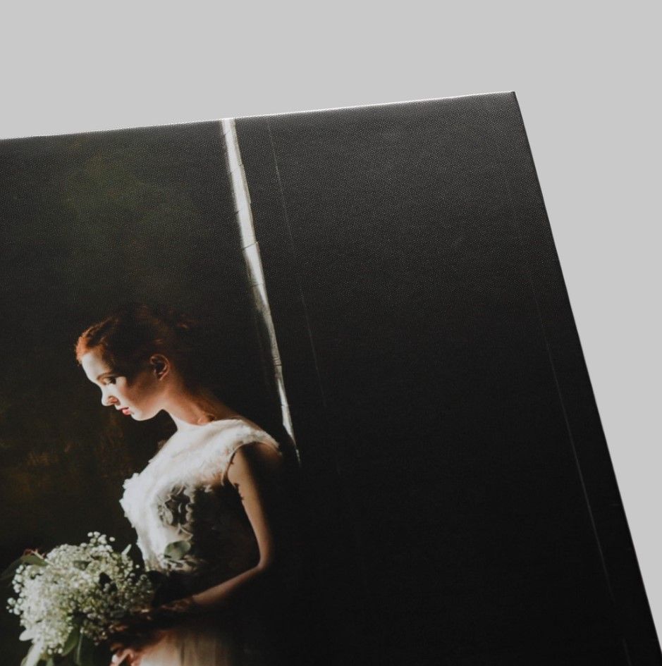 "Detailed view of the silk texture and finish of a professionally printed wedding photo.