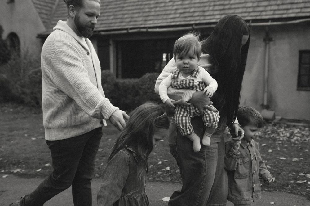A series of black and white photographs showing people sitting and interacting on a porch in a casual setting.