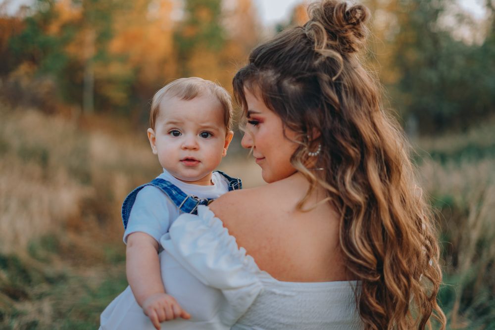 Mother and baby posing in portrait photo