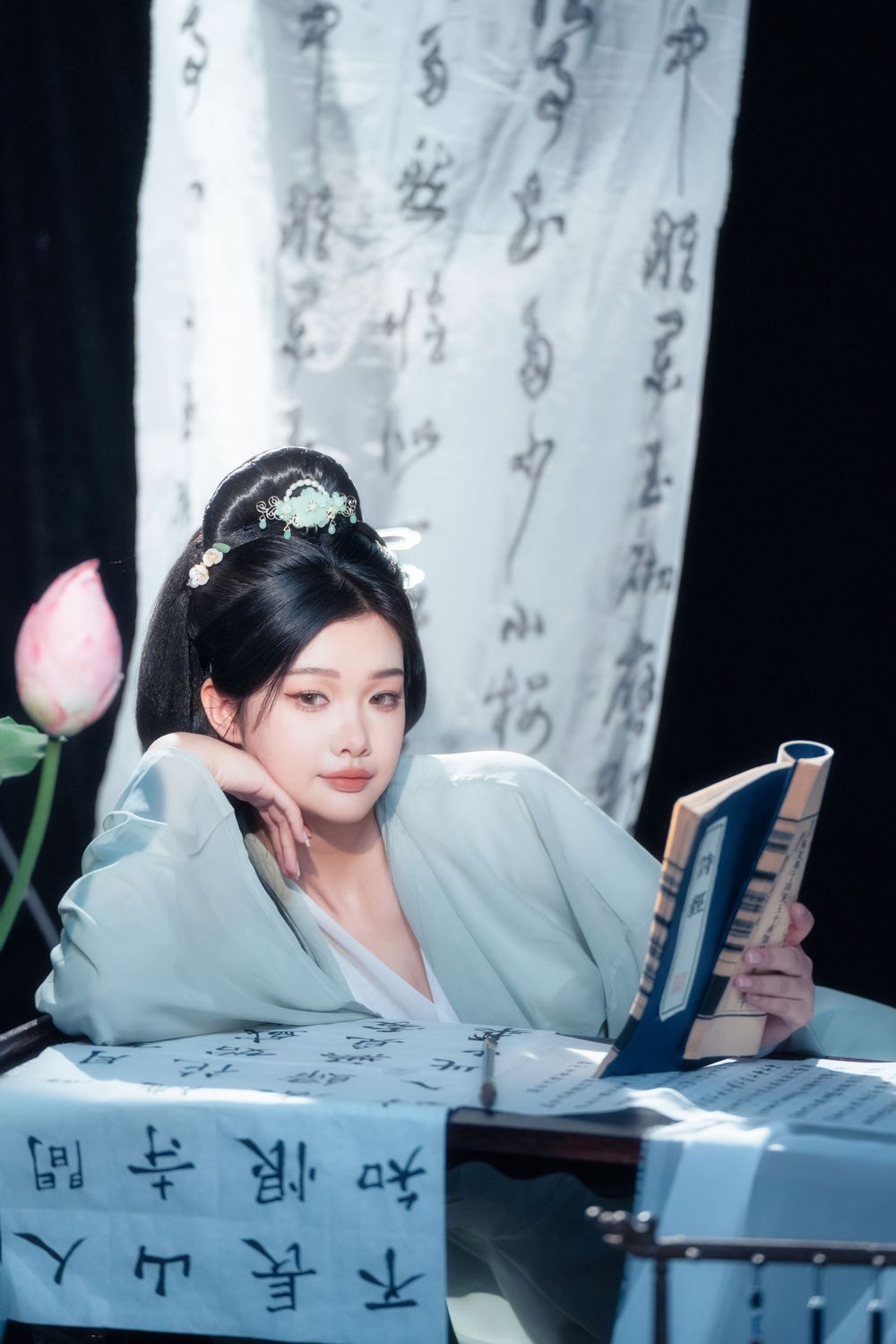 Elegant solo Hanfu portrait of a woman writing calligraphy among traditional script banners, by Imagine Image Studio.